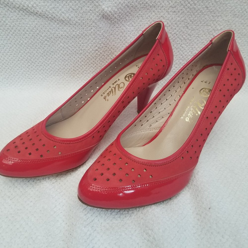 Bright red leather pumps. New and unworn.